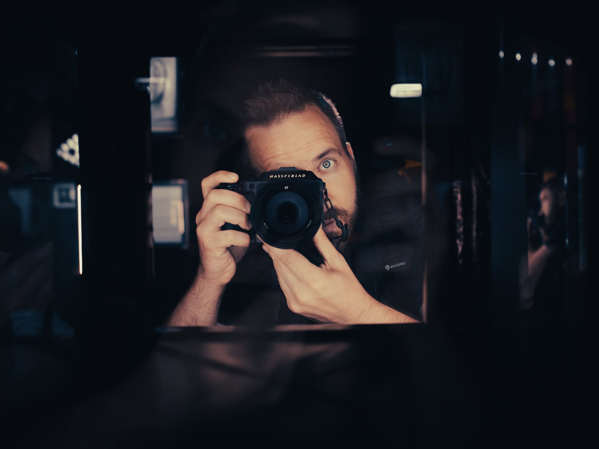 Daniel Cook, mirror self-portrait with camera raised