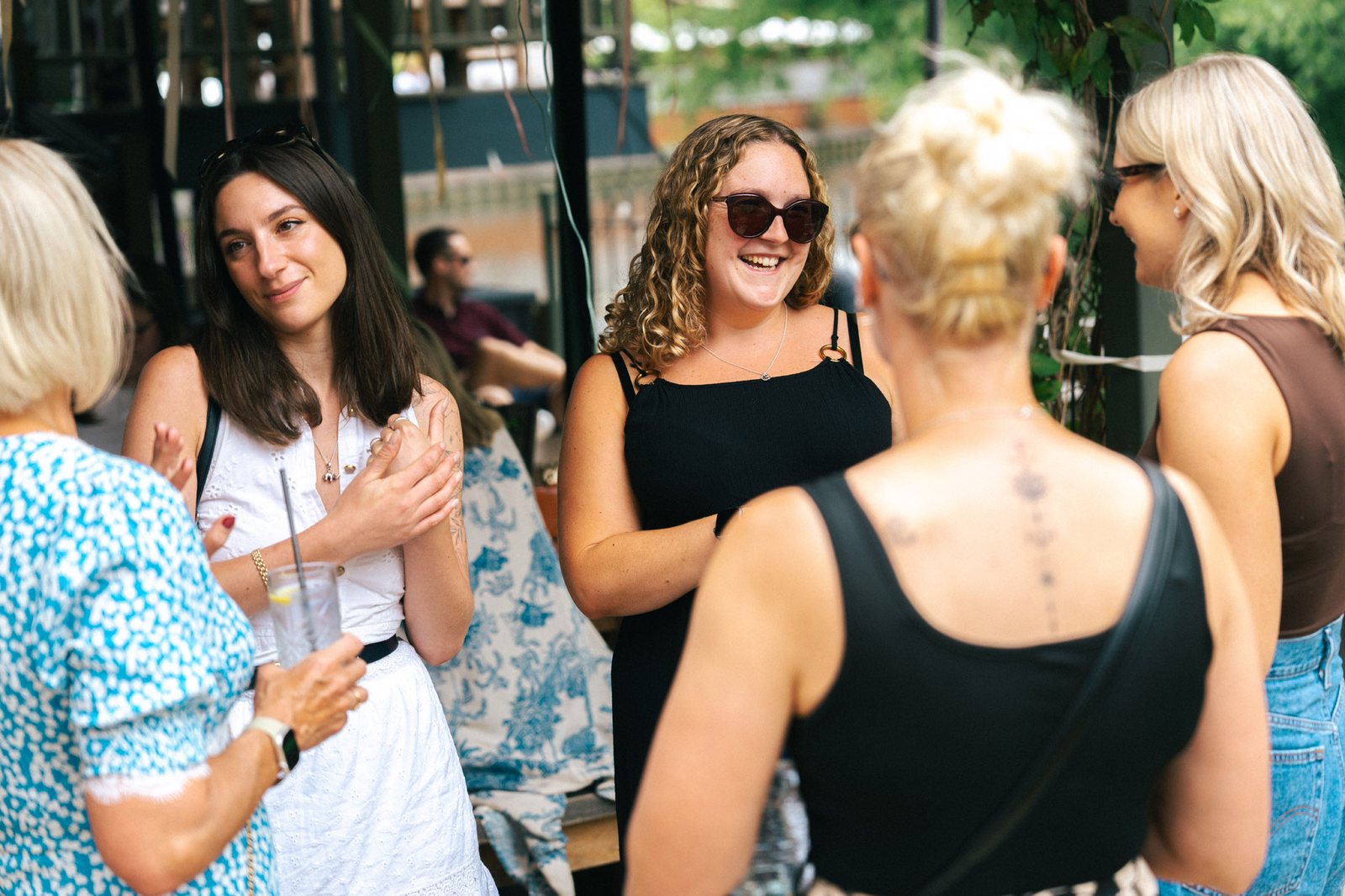 Guests laughing at a summer team event